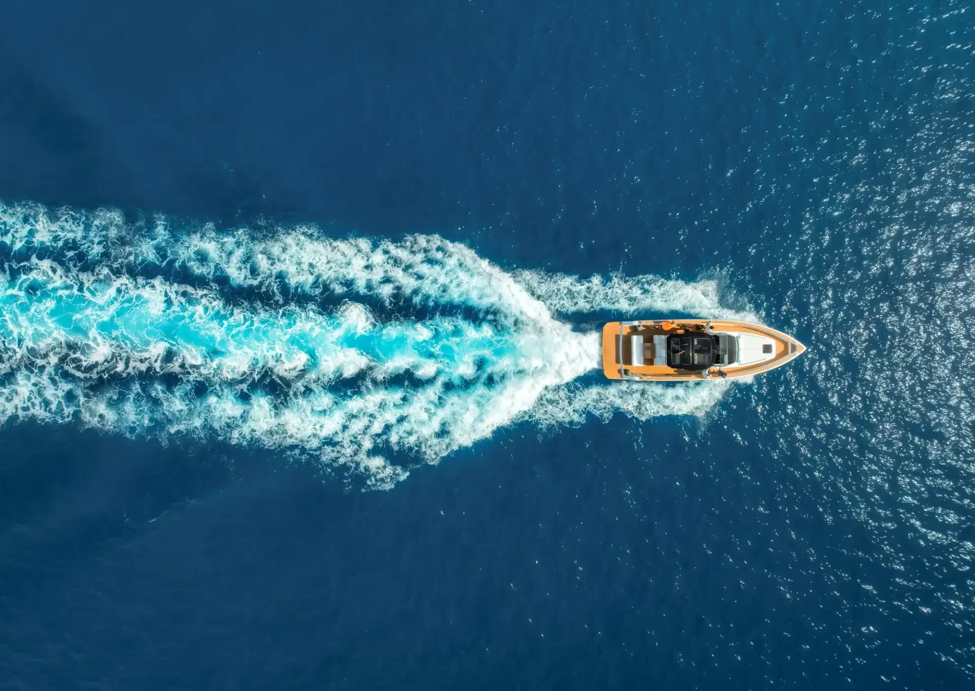 aerial-view-of-speed-boat-in-clear-turquoise-water-2026-05-14-20-13-59-utc-e1785483499342