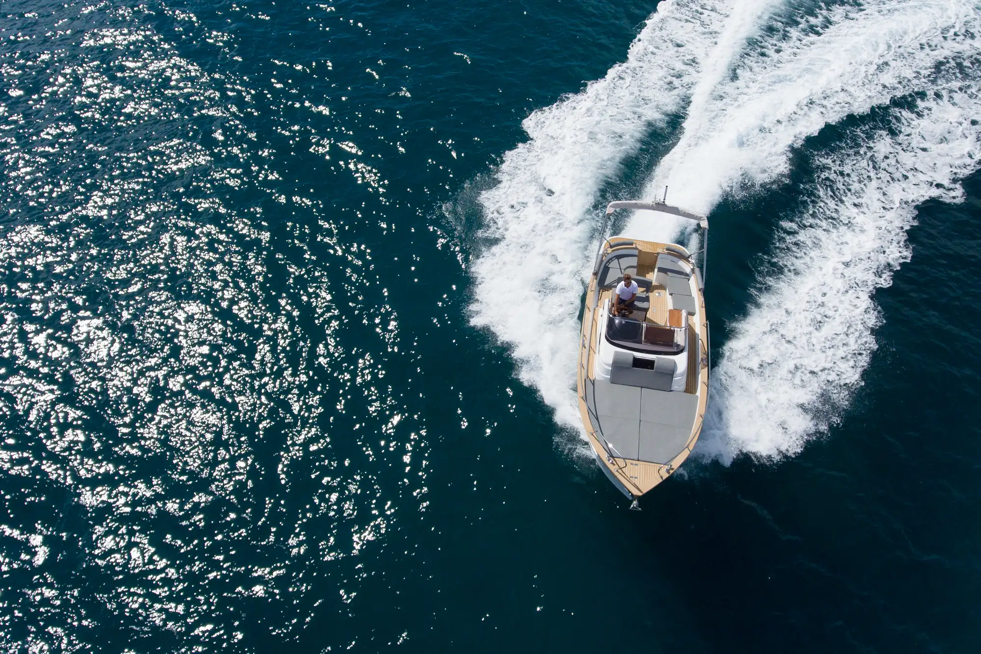 drone-top-view-of-a-small-luxury-boat-sailing-at-h-2026-03-17-05-05-04-utc