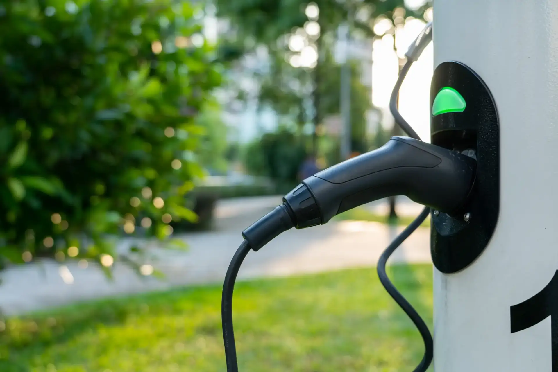 electric-vehicle-charger-in-green-urban-environmen-2026-03-18-09-41-33-utc