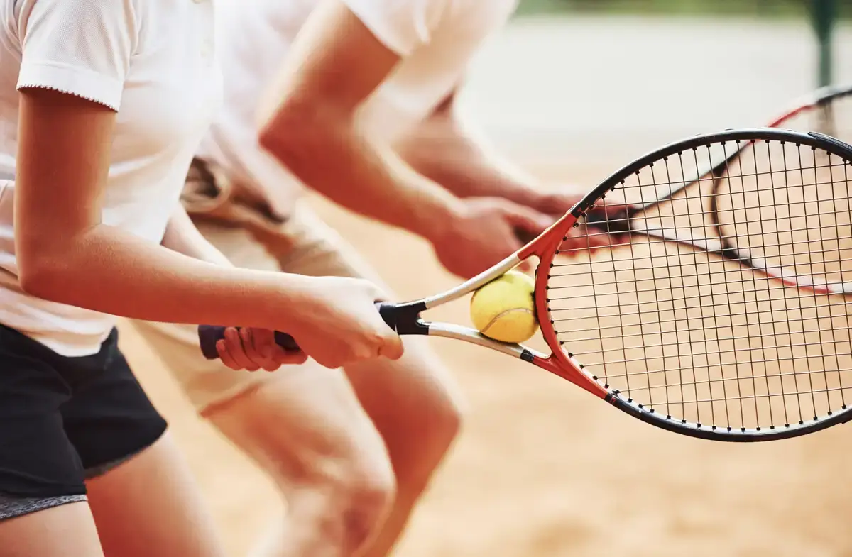 side-view-coach-teaching-female-student-tennis-ga-2026-03-24-07-10-28-utc